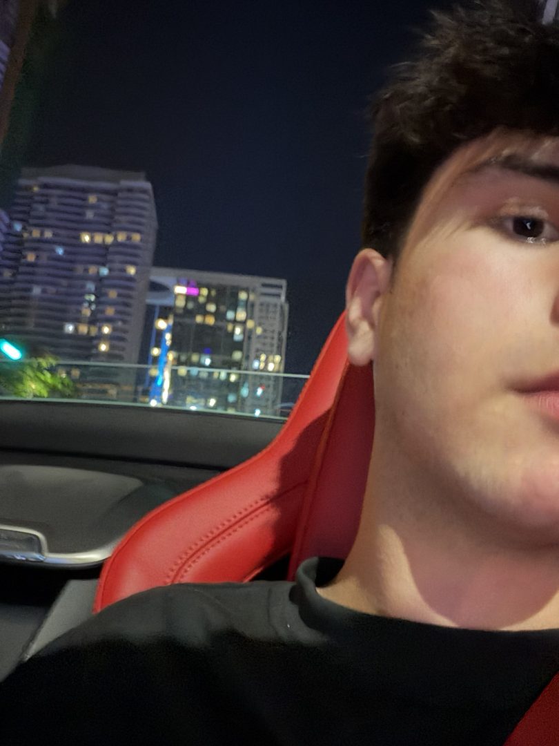 Seyhaun Bozorgi in a car at night in downtown Miami