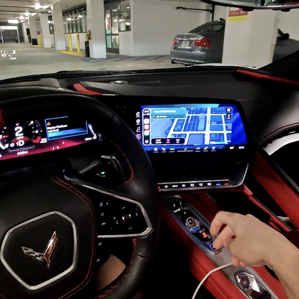 Seyhaun Bozorgi behind the wheel of a Corvette in Miami